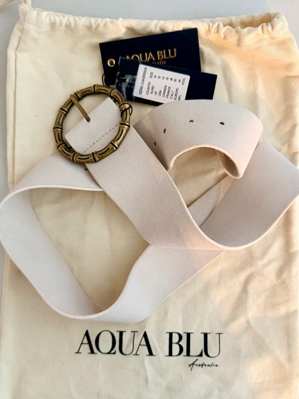 NWT, never worn ivory suede Aqua Blu belt